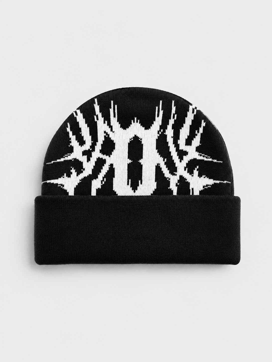 A black knit beanie hat featuring a white graphic design of a stylized face or mask on the upper half and a solid black folded cuff at the bottom, shown against a light gray background.